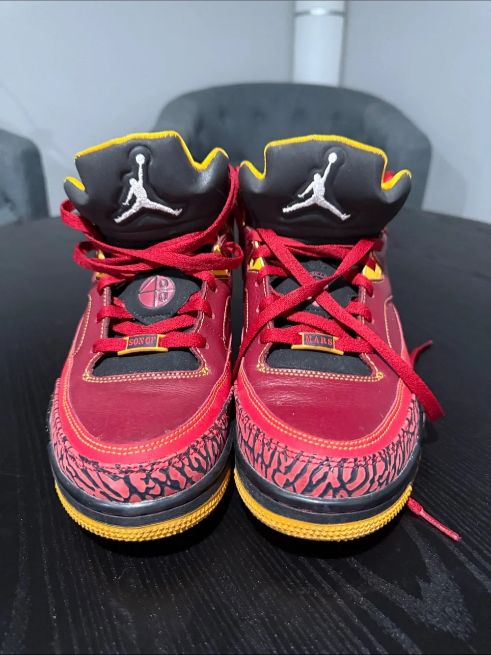 Jordan Men's Red and Black Mid-Top Sneakers with Yellow Accents